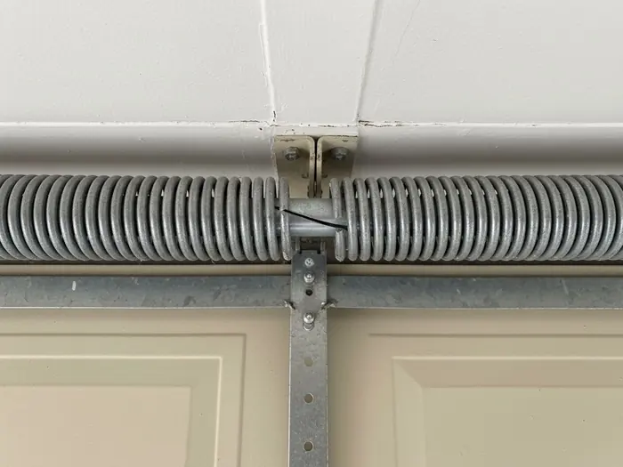 A snapped torsion spring with a visible gap in the coil